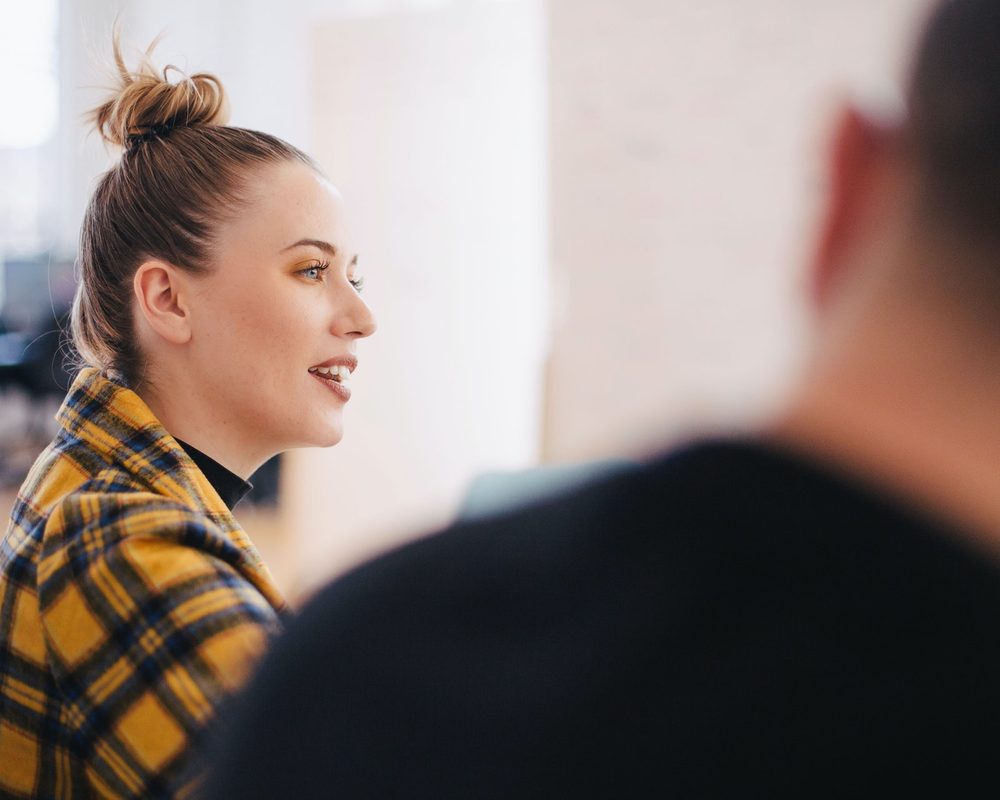 An employment solicitor listening to a client